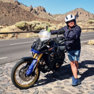 Motorcyclist next to Suzuki Vstrom 800